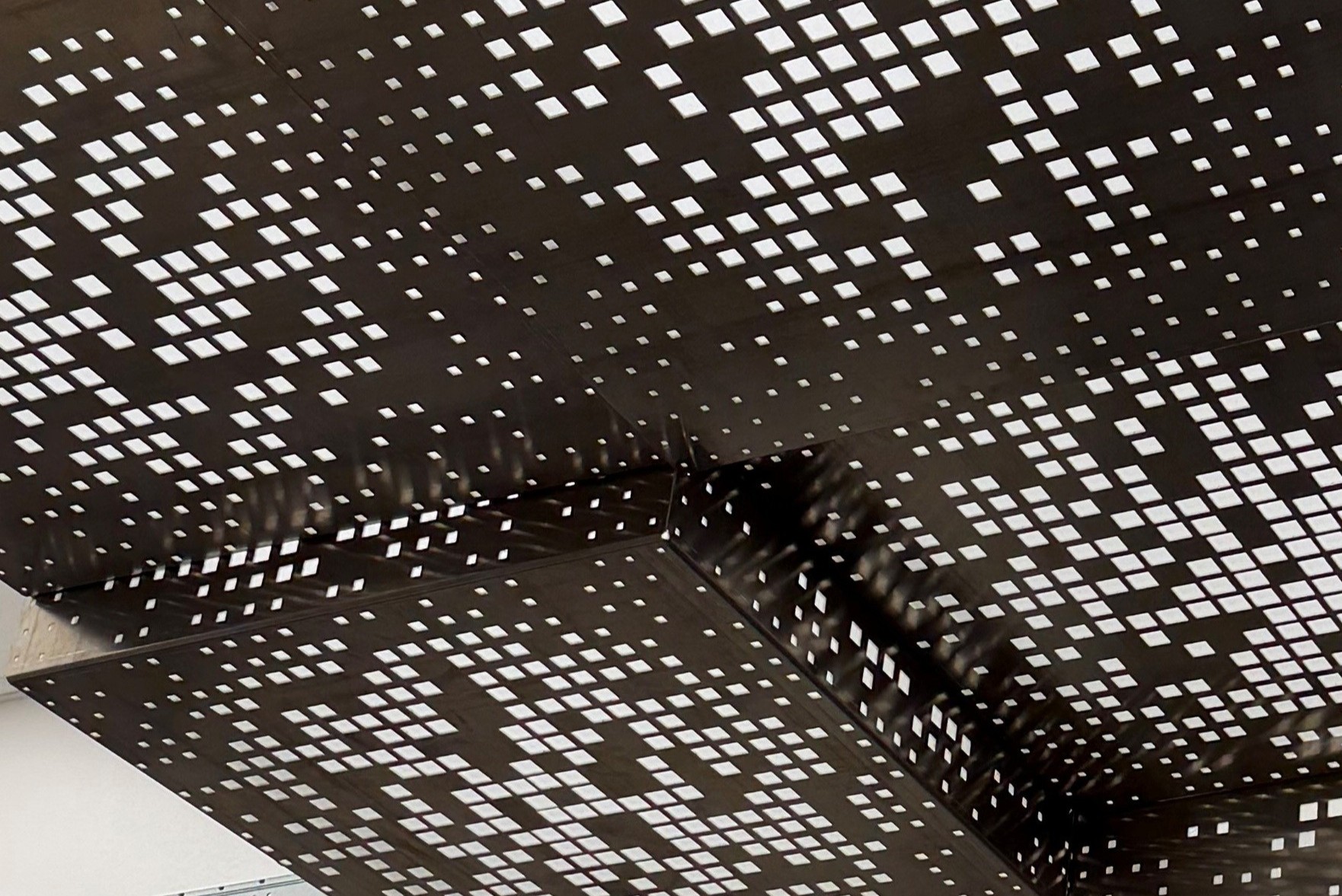 Custom 2x2 Perforate drop tiles in Austin, TX